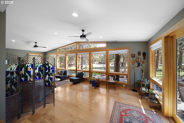living area featuring ceiling fan, light wood-type flooring, recessed lighting, and vaulted ceiling