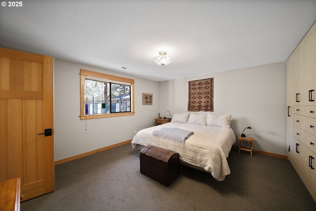 carpeted bedroom with visible vents and baseboards