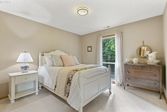 bedroom with light carpet