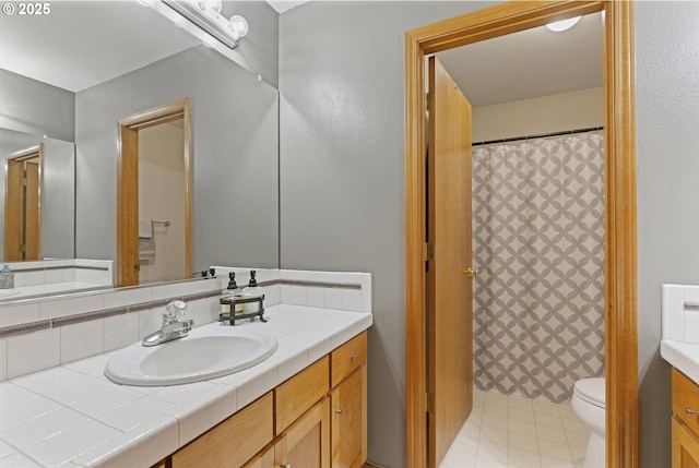 bathroom with vanity, toilet, and a shower with shower curtain