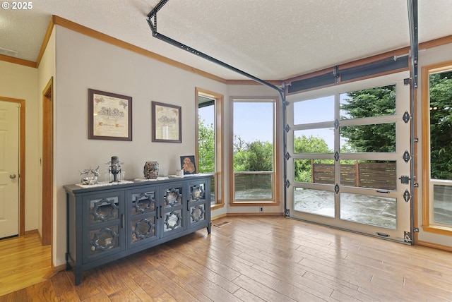 sunroom / solarium featuring french doors