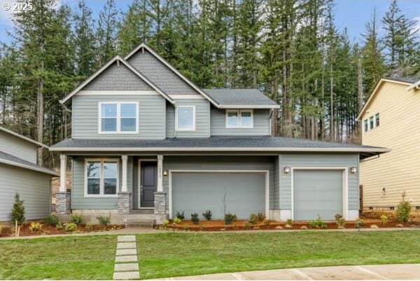 craftsman inspired home with covered porch and a front lawn