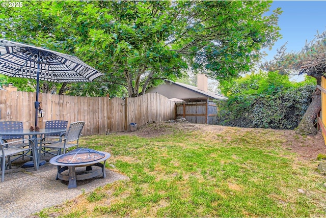 15940 SW 88th Ave, Tigard, OR 97224 - fenced backyard featuring an outdoor fire pit