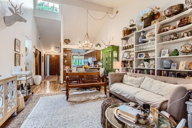 15940 SW 88th Ave, Tigard, OR 97224 - sitting room featuring high vaulted ceiling, wood finished floors, and a chandelier