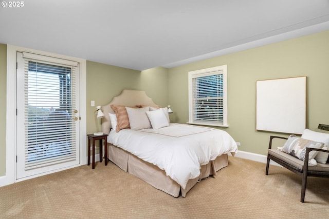 bedroom featuring light carpet