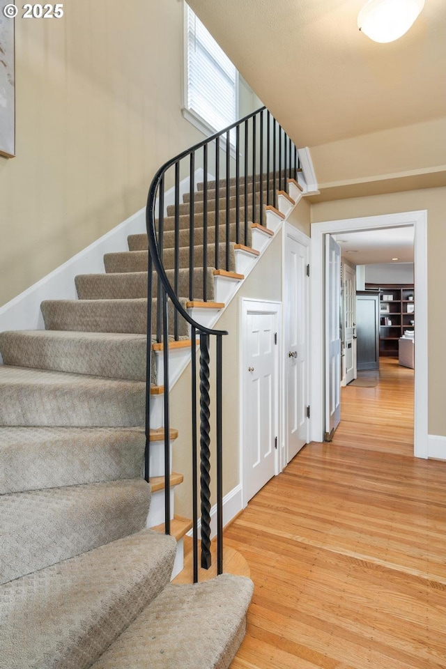 stairs with wood-type flooring