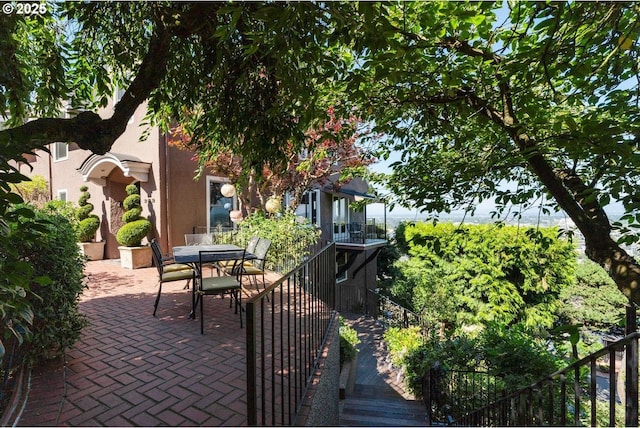 view of patio / terrace with a balcony