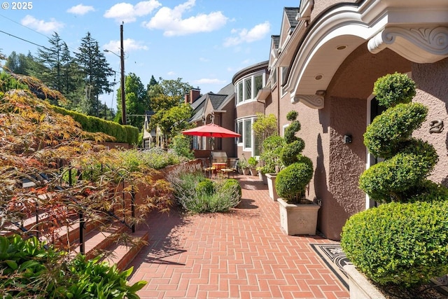 surrounding community with a patio area