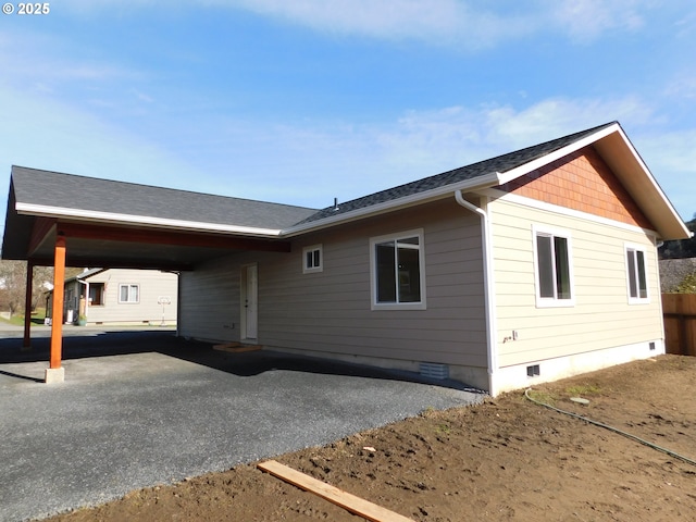 exterior space featuring a carport