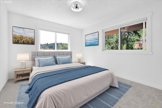 bedroom featuring baseboards and carpet flooring