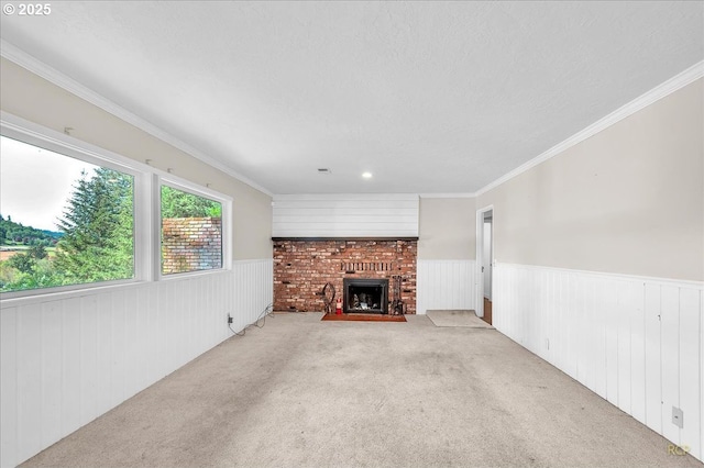 25125 SE Treehill Ln, Damascus, OR 97089 - unfurnished living room featuring a wainscoted wall, carpet flooring, a brick fireplace, and ornamental molding
