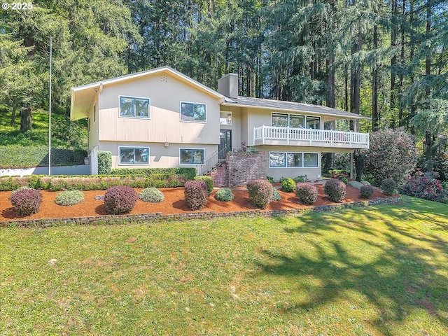 25125 SE Treehill Ln, Damascus, OR 97089 - split foyer home featuring a front lawn and a chimney