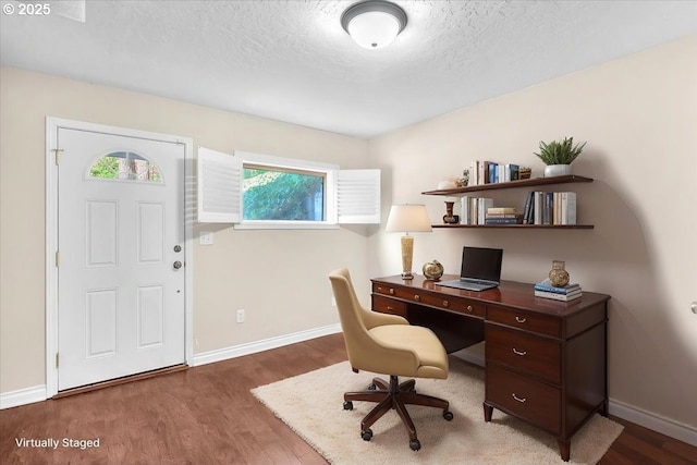 office with baseboards, a textured ceiling, and wood finished floors