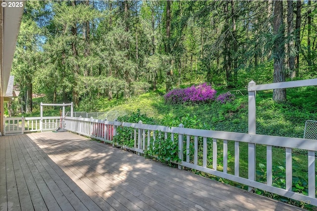 wooden terrace with a wooded view