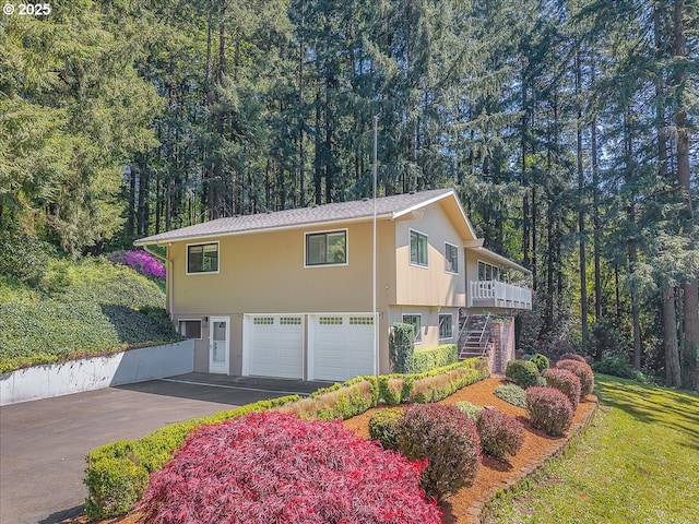 25125 SE Treehill Ln, Damascus, OR 97089 - view of front of house with an attached garage, stairway, and driveway