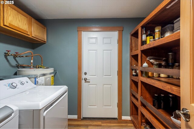332 26th Ave, Longview, WA 98632 - laundry room featuring cabinet space, washer and dryer, wood finished floors, and water heater