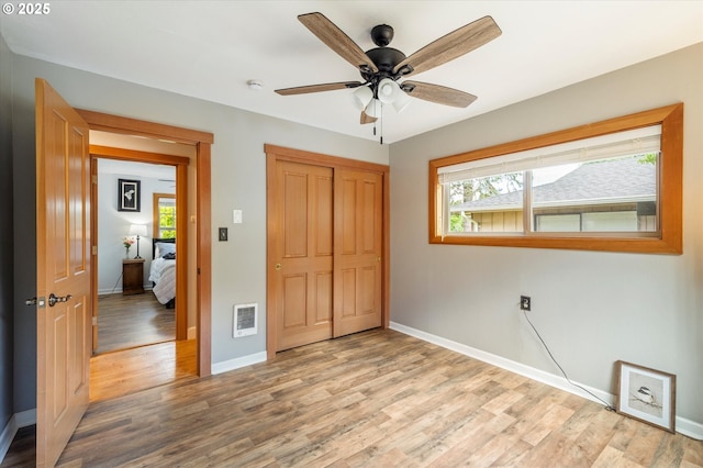 332 26th Ave, Longview, WA 98632 - unfurnished bedroom featuring light wood finished floors, baseboards, and a closet