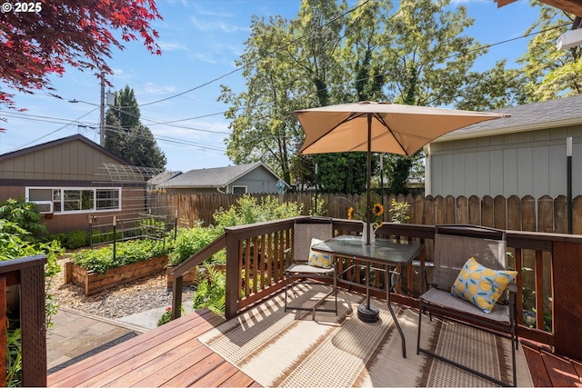 332 26th Ave, Longview, WA 98632 - wooden deck featuring a vegetable garden, a fenced backyard, and outdoor dining area