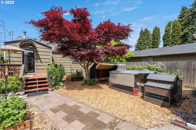 332 26th Ave, Longview, WA 98632 - view of patio / terrace with a wooden deck, a garden, and an outbuilding