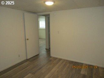 646/648 W Sixth Ave, Sutherlin, OR 97479 - empty room featuring wood finished floors and baseboards
