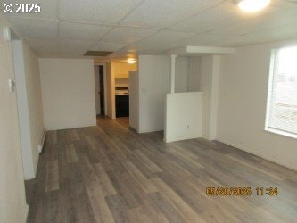 646/648 W Sixth Ave, Sutherlin, OR 97479 - empty room with wood finished floors and a drop ceiling