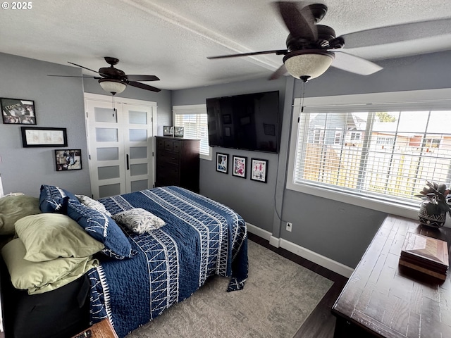 1918 Chestnut St, Baker City, OR 97814 - bedroom with wood finished floors, a textured ceiling, and a ceiling fan