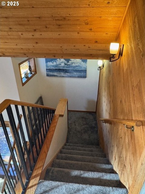 staircase with wood ceiling and lofted ceiling