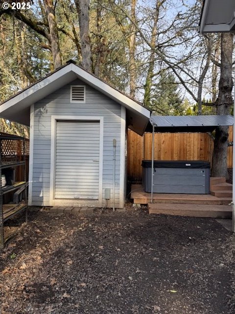 view of outbuilding featuring a hot tub