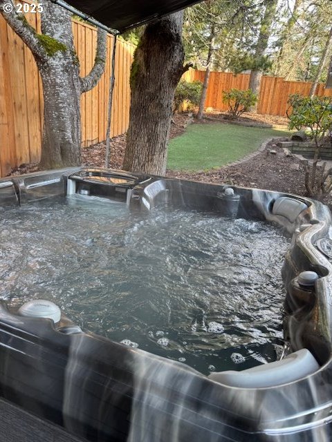 exterior details featuring a hot tub