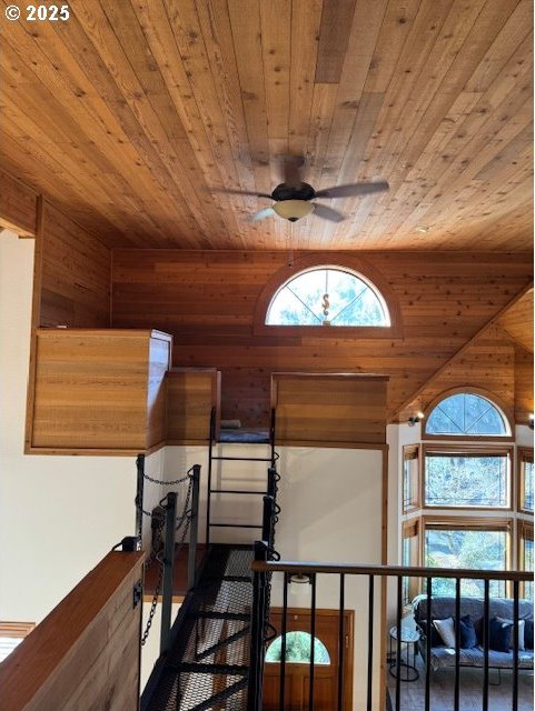 interior space featuring wooden ceiling and ceiling fan