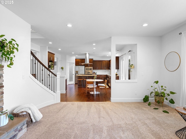 15582 SE Owl Ln, Happy Valley, OR 97015 - living area with dark colored carpet, baseboards, recessed lighting, stairs, and dark wood finished floors