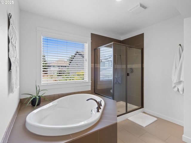 15582 SE Owl Ln, Happy Valley, OR 97015 - full bathroom featuring a bath, a stall shower, tile patterned flooring, and baseboards