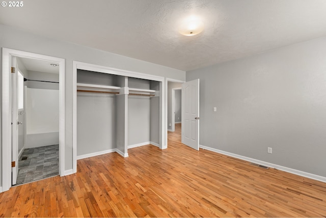 2431 W Crestview Ave, Roseburg, OR 97471 - unfurnished bedroom featuring light wood-style floors and a closet