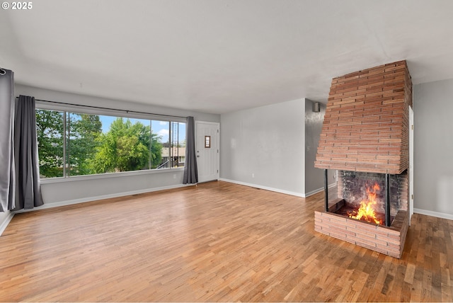 2431 W Crestview Ave, Roseburg, OR 97471 - unfurnished living room with a fireplace and wood finished floors