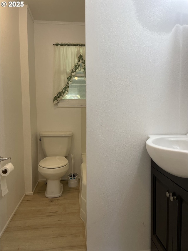 154 Decoy Ln, Myrtle Creek, OR 97457 - full bath with wood finished floors, vanity, toilet, a tub to relax in, and baseboards