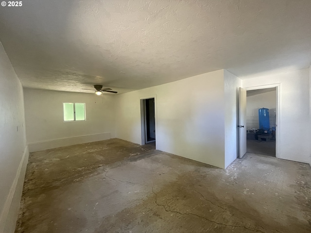 154 Decoy Ln, Myrtle Creek, OR 97457 - spare room featuring concrete floors, a textured ceiling, and a ceiling fan