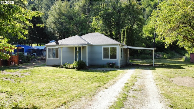 154 Decoy Ln, Myrtle Creek, OR 97457 - bungalow featuring driveway, a front lawn, an attached carport, and roof with shingles