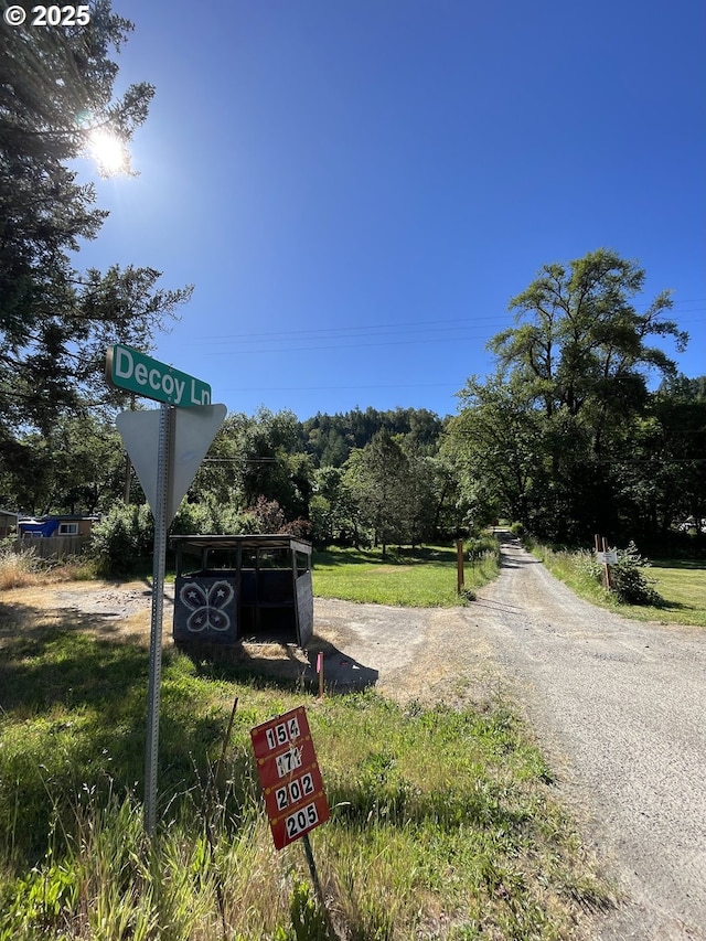 154 Decoy Ln, Myrtle Creek, OR 97457 - view of asphalt road featuring traffic signs