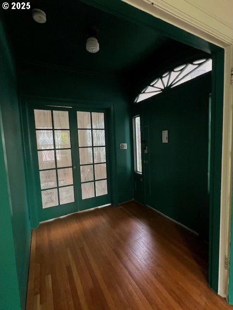 interior space with french doors and wood finished floors