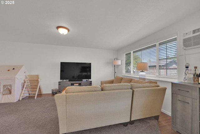 921 Williams St, Eugene, OR 97402 - living area featuring a wall unit AC, baseboards, and dark wood-type flooring