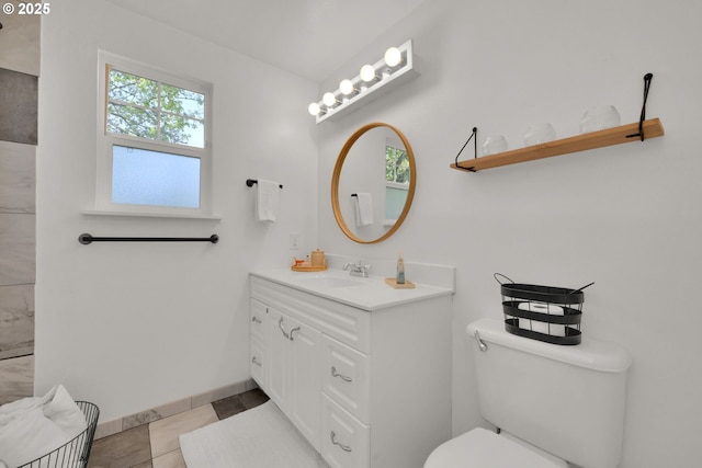 921 Williams St, Eugene, OR 97402 - bathroom featuring vanity, toilet, and baseboards
