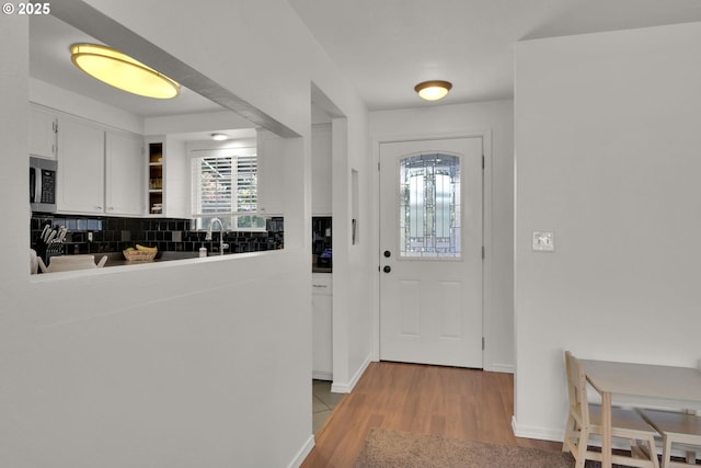 921 Williams St, Eugene, OR 97402 - entryway featuring light wood-style flooring and baseboards
