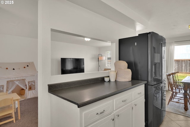 921 Williams St, Eugene, OR 97402 - kitchen with fridge with ice dispenser, dark countertops, and healthy amount of natural light