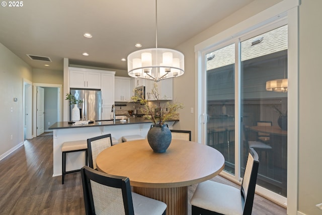 7314 NE 66th St, Vancouver, WA 98662 - dining room featuring recessed lighting, dark wood-type flooring, a chandelier, and baseboards