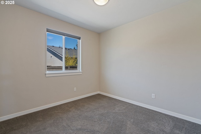 7314 NE 66th St, Vancouver, WA 98662 - spare room featuring dark carpet and baseboards