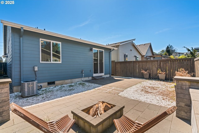 7314 NE 66th St, Vancouver, WA 98662 - rear view of house featuring a patio, central air condition unit, a fenced backyard, and an outdoor fire pit