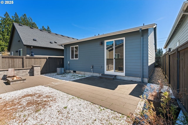 7314 NE 66th St, Vancouver, WA 98662 - rear view of house featuring a fire pit, a patio area, a fenced backyard, and central AC