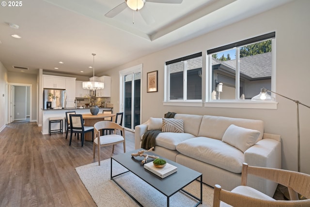 7314 NE 66th St, Vancouver, WA 98662 - living room featuring recessed lighting, wood finished floors, a ceiling fan, baseboards, and a chandelier