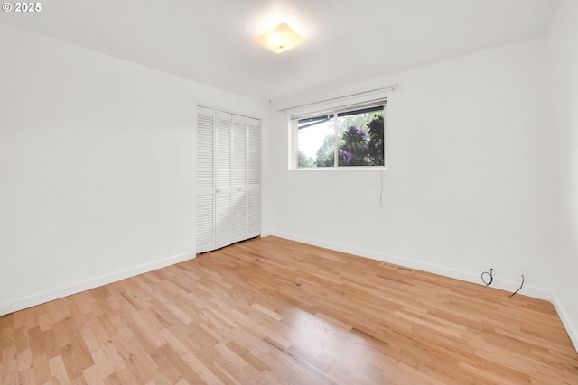 2801 Kincaid St, Eugene, OR 97405 - spare room featuring baseboards and light wood-style floors