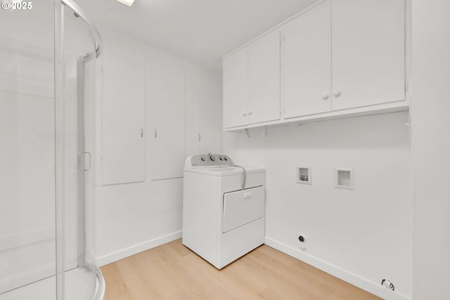 2801 Kincaid St, Eugene, OR 97405 - laundry area featuring washer / clothes dryer, light wood-style flooring, baseboards, and cabinet space